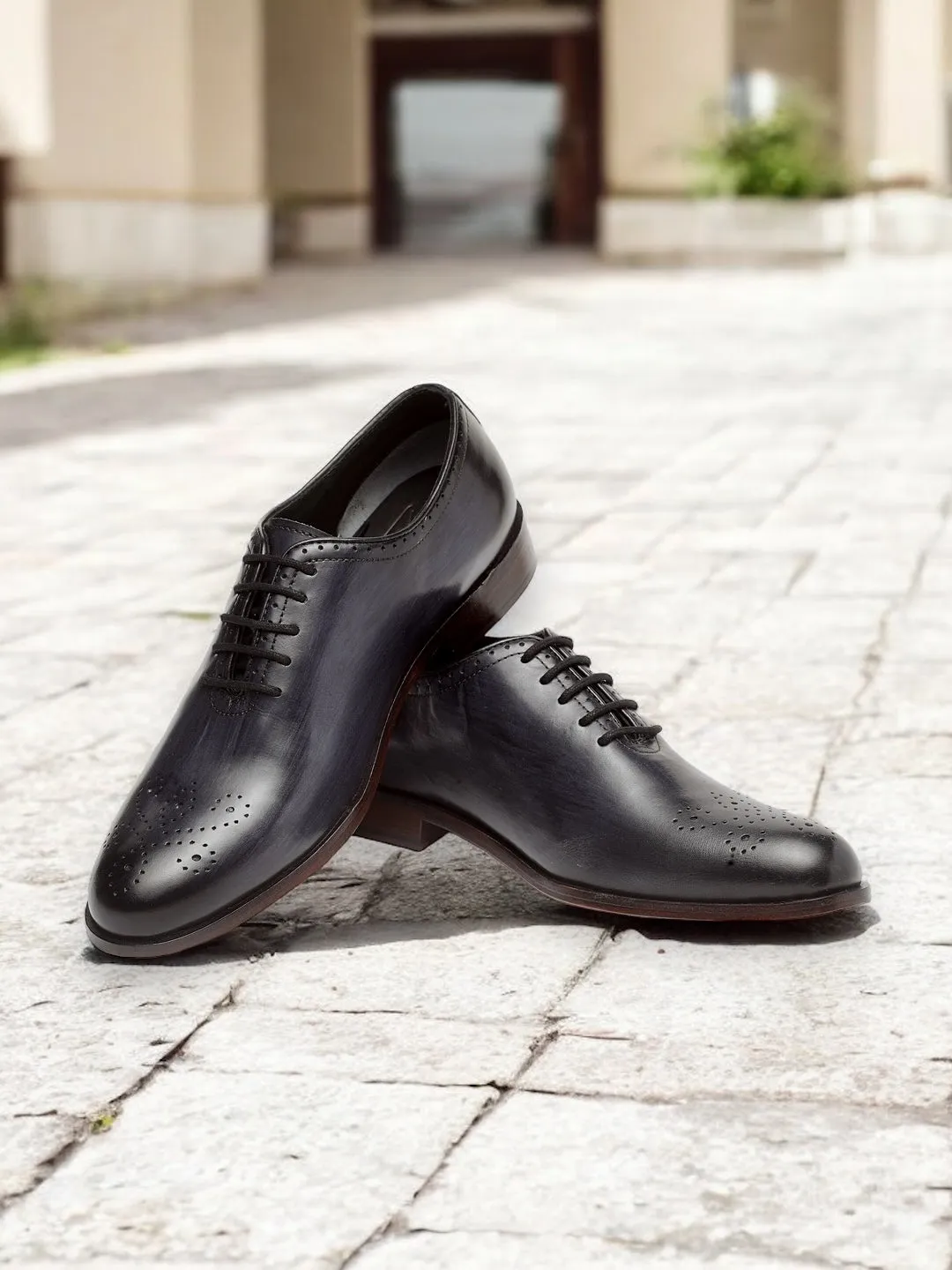Noir Crest — Perforated Wholecut Oxford