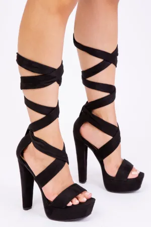 QISTINA HIGH HEEL PLATFORM WITH LACE-UP STRAPS IN BLACK SUEDE